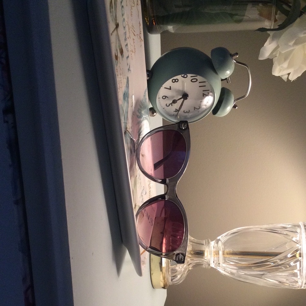 Loft sunglasses in smoky green cat-eye style.